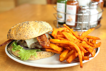 Delicious gourmet hamburger served with French fries