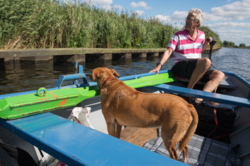 Man with dog in the boat