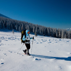 Hiker in winter mountains