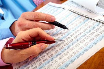 Hands of accountant business woman.