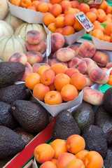 Apricots, fig peach,  purple avocados, melons at fruit market