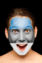 girl with estonian flag painted on her face