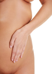 Fit young woman belly with hand on it