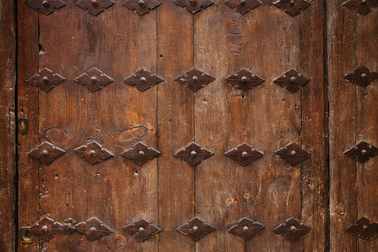 old wooden door with metal ornate background