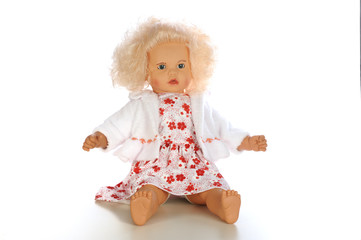 Belonde baby doll sitting isolated white bacground