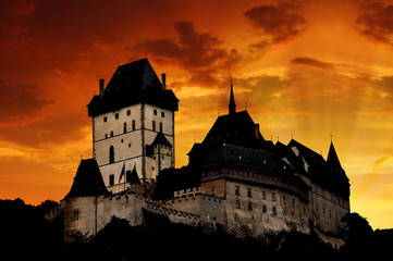 Sunset above the royal castle Karlstejn in Czech Republic