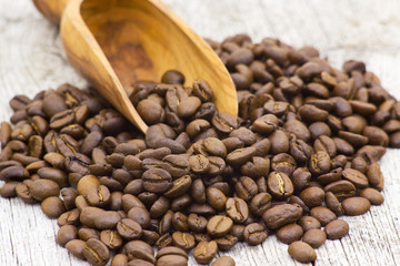 Coffee beans on old wooden background