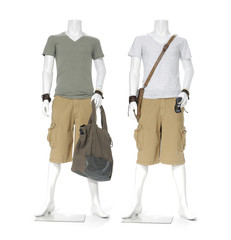 Full length two male mannequin dressed in short pants with bag,