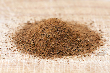 cinnamon powder on wood