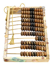 abstract composition from the old abacus, coins and shells isola