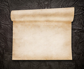 Aged scroll paper, old leather on background