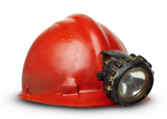 vintage miners helmet with lamp on a white background