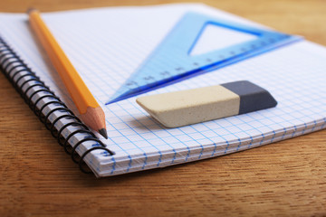 Close up of notebook with pencil and eraser
