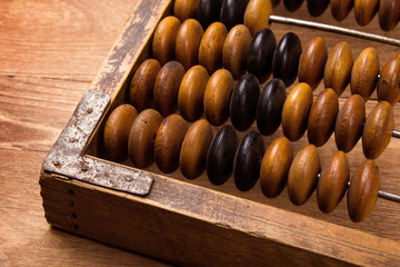 Fragment of old abacus close up