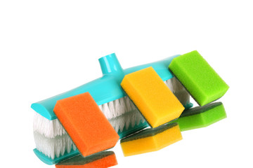 brush for a floor and a sponge on a white background