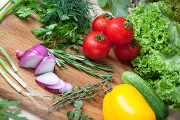 Fresh vegetables on cutting board.