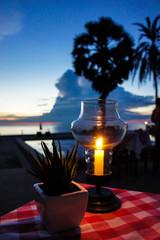 Beach front dining with candle