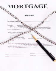 Mortgage. Contract entwined chain and pen