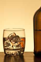Glass and botlle of rum