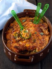 Baked beans and pumpkin with aromatic herbs