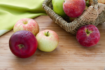 Red apples on wooden table