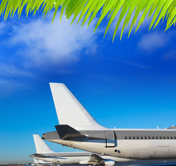 Airplanes in a row under blue sky