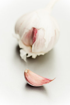 Close up of purple garlic bulb and clove