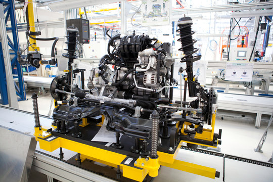 car engine assembled standing on the factory production line