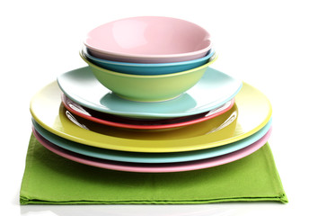 Colorful plates on napkin isolated on white