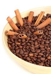 Coffee beans in bamboo bowl isolated on white