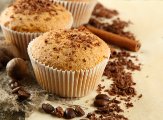 tasty muffin cakes with chocolate, spices and coffee seeds,