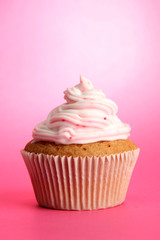 tasty cupcake, on pink background