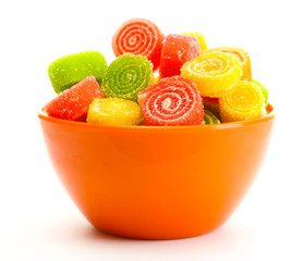 colorful jelly candies in bowl isolated on white.
