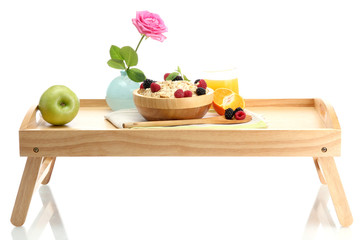 light breakfast on wooden tray isolated on white