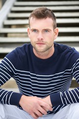 Fototapeta premium Portrait of a Handsome Man Sitting