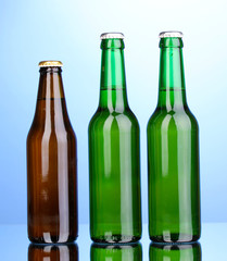 bottles of beer on blue background