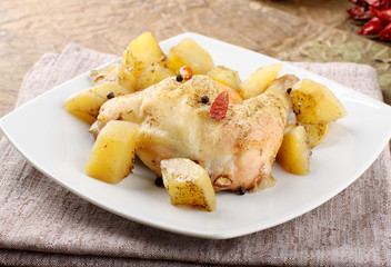 Chicken leg baked with potatoes