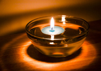 Aromatherapy candle floating in oil