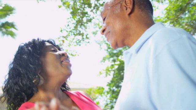 African American Couple Dancing Retirement Home Garden