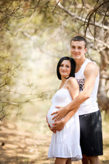 young family with a sun on the nature