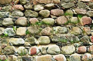 Backdrop of retro castle stone wall and grass grow
