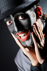 Businessman with clown face paint