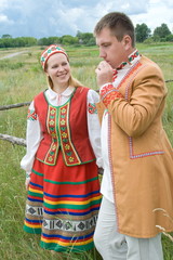 Young man and woman in national dress of Belarusian.