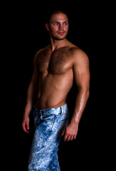 Fototapeta na wymiar Portrait of a handsome muscular guy with nude torso