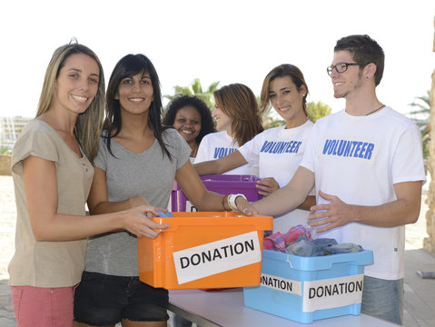Group of volunteers collecting clothing donations