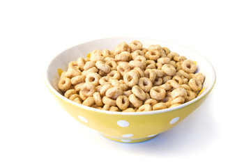 Bowl of breakfast cereal loops on white background