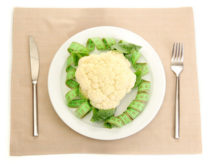 Fresh cauliflower and measuring tape