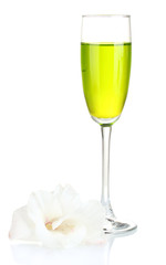 glass with cocktail and gladiolus bud isolated on white