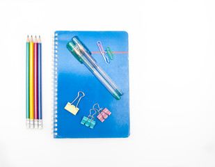 Book, pens, pencils and clips