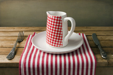 Table arrangement with jug and plate